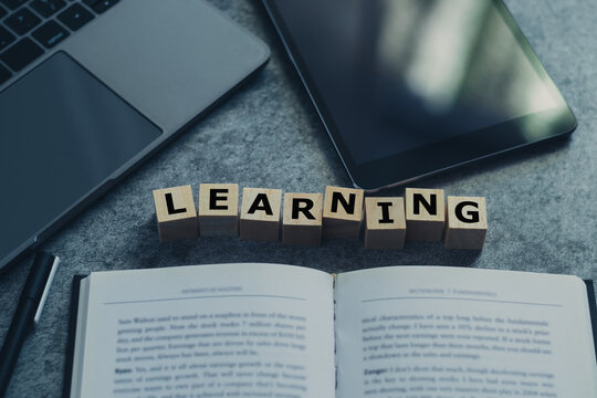 Laptop, tablet, and book or textbook. Self learning or education knowledge and business studying concept. Idea of learning online class or e-learning at home.