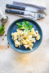 scrambled fried eggs scrumble fresh breakfast organic, wholesome dish on the table healthy food meal snack copy space food background rustic. top view keto or paleo diet