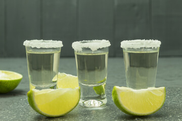 Tequila in a glass with salt and lime