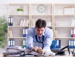 Fototapeta na wymiar Angry businessman frustrated with too much work