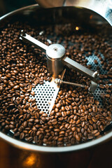 Roasted coffee beans in the machine at a coffee shop