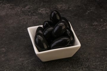 Pickled black olives in the bowl