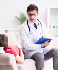 Pregnant woman patient visiting doctor for regular check-up