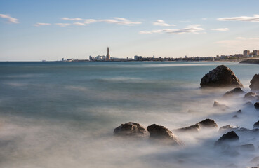 Long exposure landscape photography of the city of Barcelona from the beach