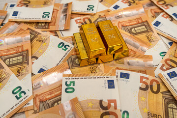 Gold bars on 50 euro bills as financial  concept