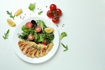 Concept of tasty eating with salad with grilled chicken on white background