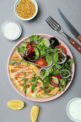 Concept of tasty eating with salad with grilled chicken on gray background