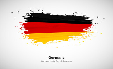 Creative happy german unity day of Germany country with grungy watercolor country flag background