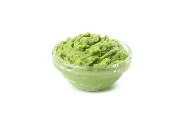 Bowl with wasabi isolated on white background