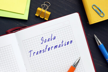  Financial concept meaning Scale Transformation with sign on the sheet.