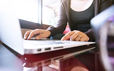 Accountant Working women use calculator with Spreadsheet document information financial concept