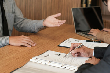 Fototapeta premium Examiner reading a resume during job interview at office Business and human resources concept