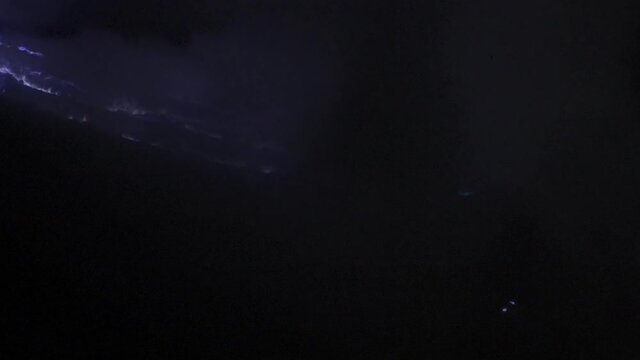 Panning Purple Flames And Rising Smoke At Night In A Volcanic Sulphur Quarry - East Java, Indonesia