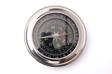 Magnetic silver metal compass on white background