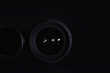 Optics to the camera on the operator’s desk. Flare in the glass of a photo lens. Background with...