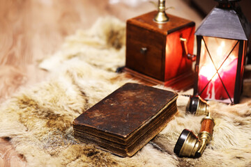 Retro old book and world desk globe on fur, learning and education concepts.