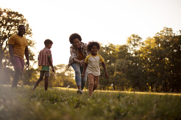 African American family having fun outdoors.