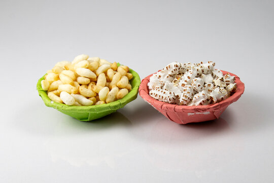 puffed rice and popped rice in green and pink paper bowl.