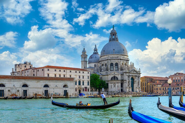 Fototapeta na wymiar Grand canal with gondola and Basilica di Santa Maria della Salute in Venice, Italy. Architecture and landmarks of Venice. Venice postcard