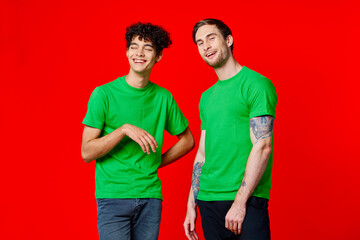 Fototapeta premium two friends cover their hand face emotions displeasure red background