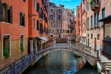 Narrow canal with bridge in Venice, Italy. Architecture and landmark of Venice. Cozy cityscape of...