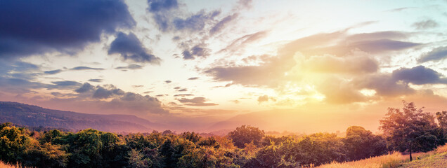Fototapeta na wymiar Panorama of landscape mountains valley during the sunset. Natural outdoor background concept