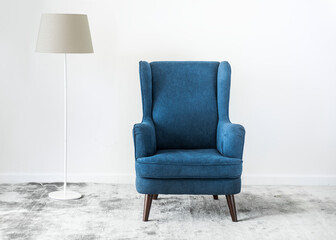 Wingback blue couch in a room
