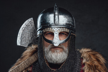Headshot of proud elder knight with fur and axe