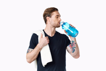 sporty man in black t-shirt workout water bottle