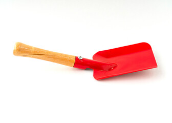 Small red color shovel isolated on white background.