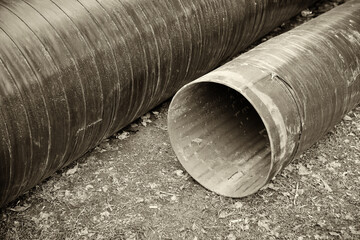 Replacement of the sewer pipeline within the city limits. On the ground are two new pipes,...