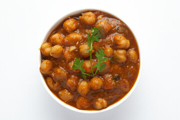 Chickpeas masala (Spicy chola or chhole curry)  garnished with fresh green coriander and...