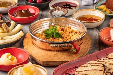 Traditional Turkish Breakfast served with traditional turkish tea on stone table