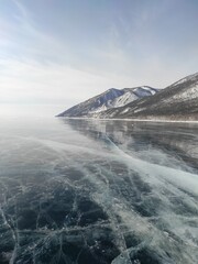 lake with transparent ice and cracks