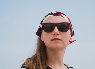 Confident girl in sunglasses american flag bandana. USA Independence Day patriotism concept,...