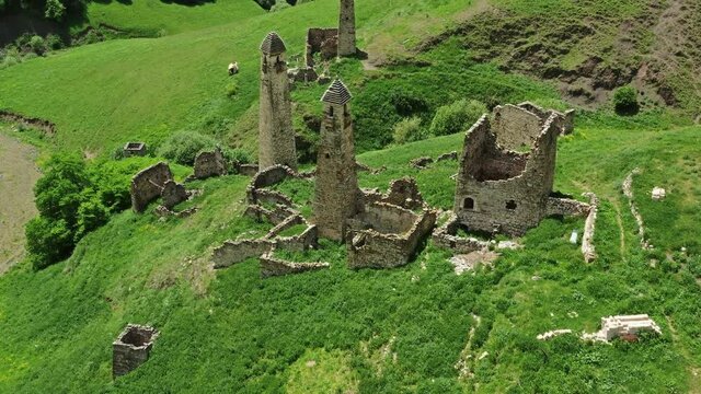 Aerial view of medieval tower complex in the mountains of Ingushetia, Russia, 4k