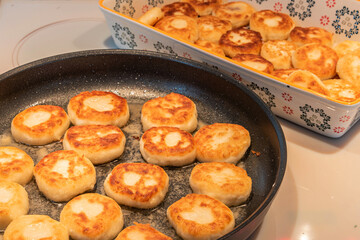 Cheesecakes or Syrniki on a pan. Russian and Ukrainian Cuisine