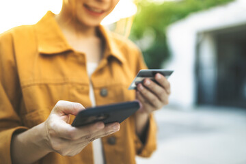 Hands of woman holding using mobile phone and credit card, Online shopping Website, Shop online by Smartphone.