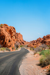 Panorama of the road in the Valley of Fire Park in Nevada. Amazing scenery on the road between the orange rocks