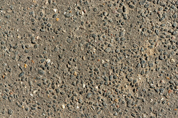 texture of a concrete wall with small splashes of gravel