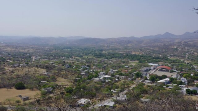 High angle shot of plants and hills on a sunny day in Mixteca Poblana, Puebla, Mexico