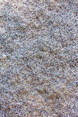 Natural pattern and texture of raw red granite. As a stone background.