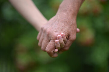 granddaughter and grandfather  holding hands