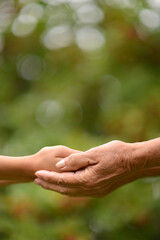 person holding granddaughter's hand