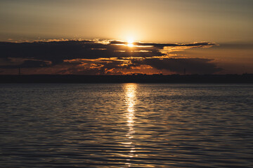 Naklejka premium sunset over the river