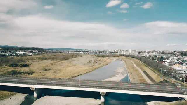 Mutsumi Bridge Over Tama River in Hajima Tokyo Japan. Aerial pull up