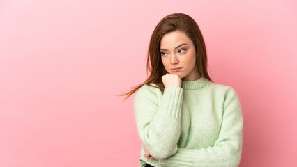 Teenager girl over isolated pink background with tired and bored expression