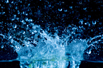 Water splashes on a black background.soft focus.

