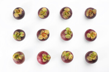 Fresh ripe mangosteen fruits on white background, top view