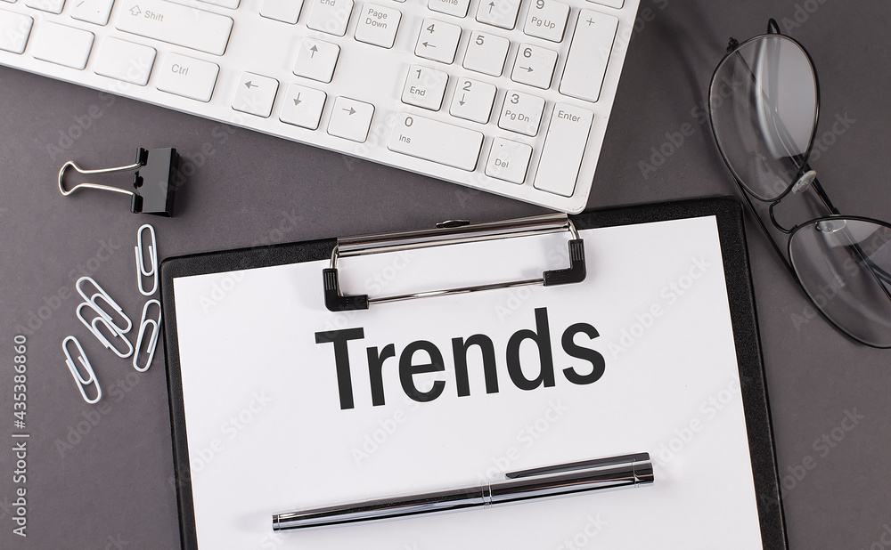 Poster office paper sheet with text trends and keyboard. business concept